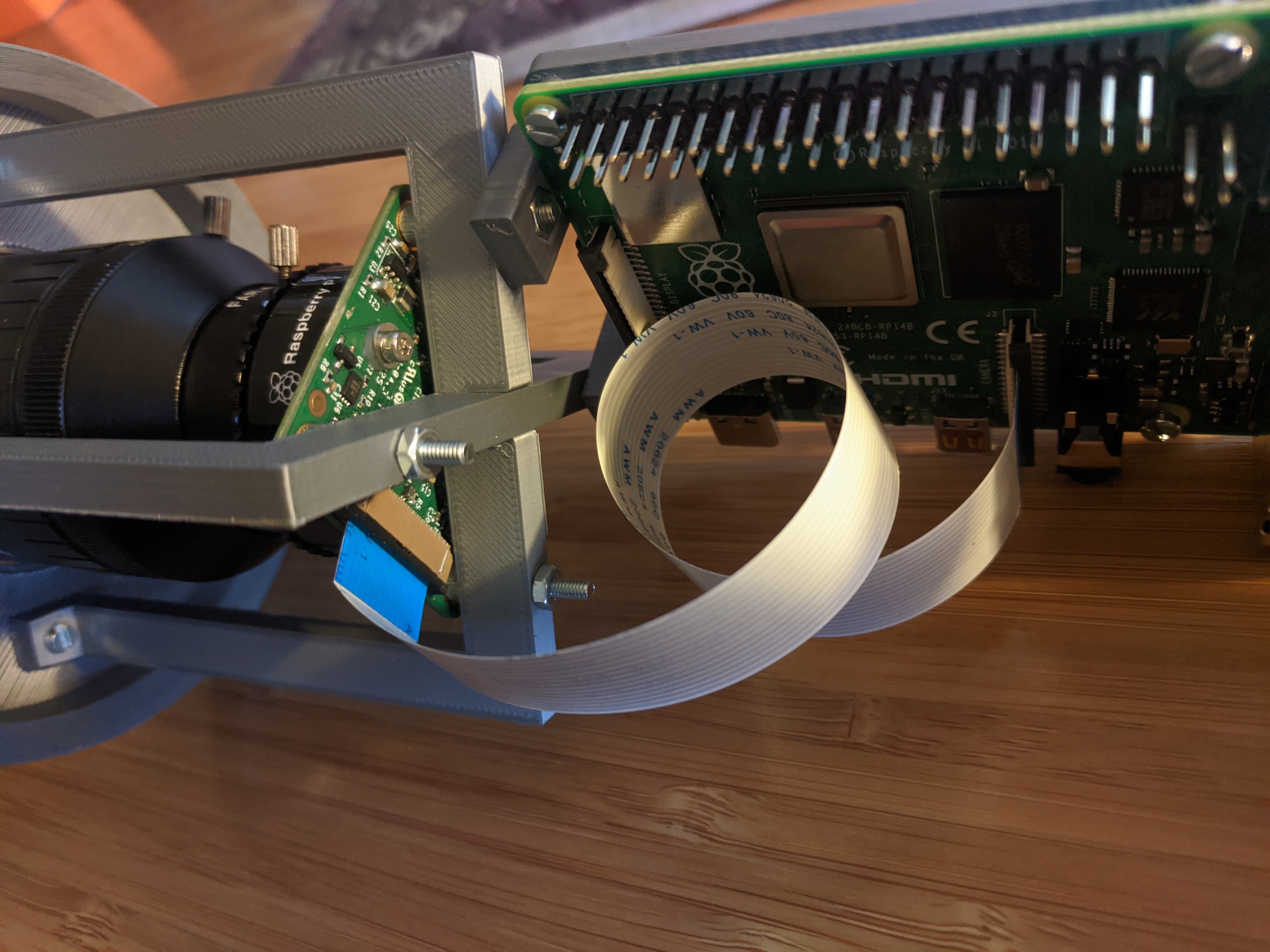 Camera support assembly attached to Raspberry Pi support structure