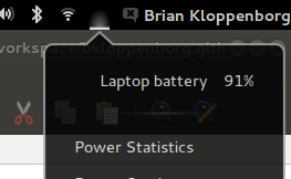The battery icon in Gnome 3 is dark if you have previously used Unity